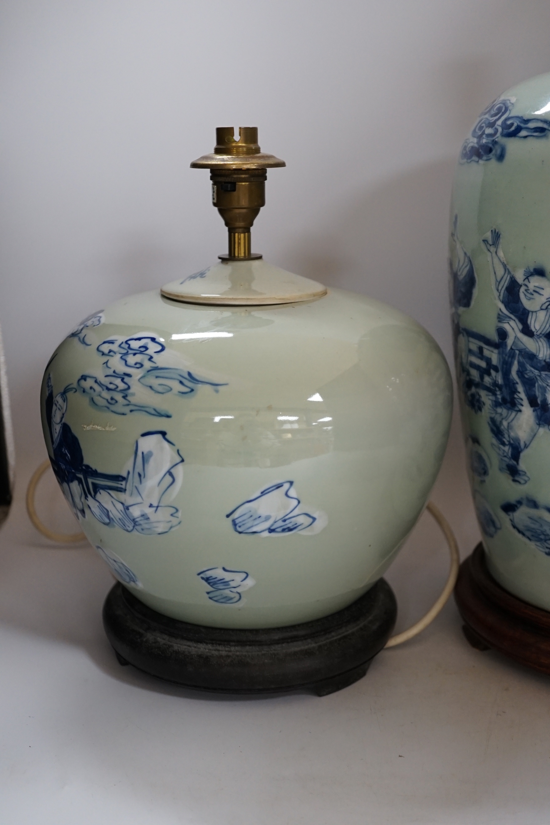 Two Chinese blue and white celadon glazed lamp bases, largest 43cm high including fitting
